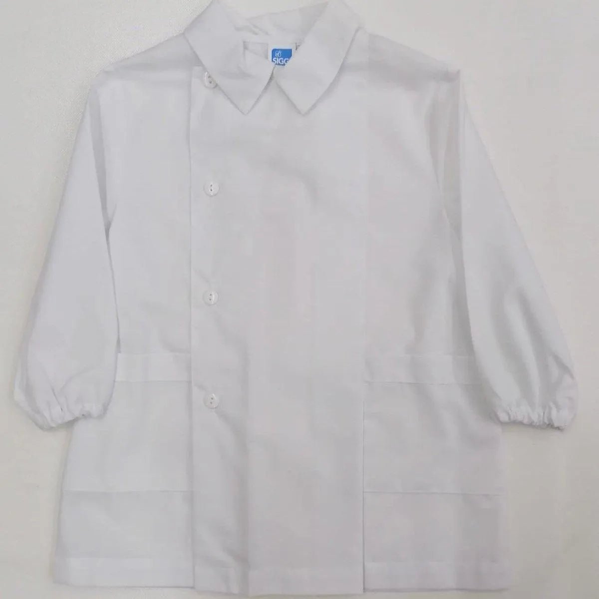 Grembiule bianco asilo bambino con abbottonatura laterale Siggi senza ricamo 1961