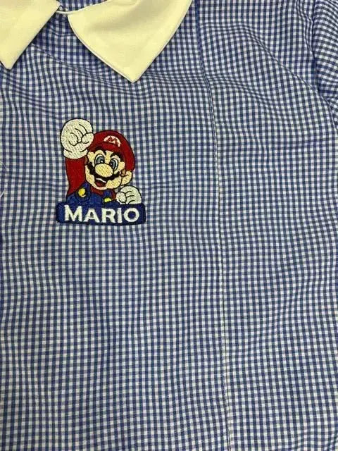Grembiule quadretti azzurri asilo bambino con abbottonatura laterale Nintendo Super Mario Bros G304