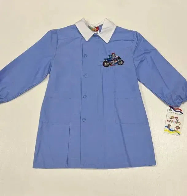 Grembiule scuola elementare bambino celeste con abbottonatura laterale Moto MN906
