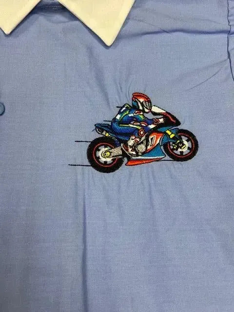 Grembiule scuola elementare bambino celeste con abbottonatura laterale Moto MN906